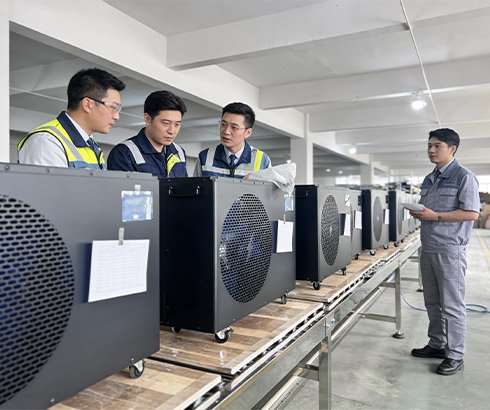 Engineering team optimizing ice bath chiller production